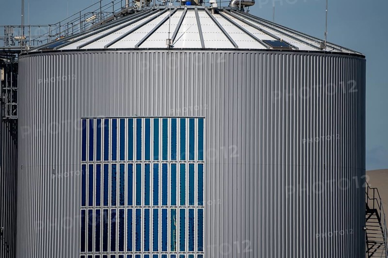 RWE biogas plant Bergheim-Paffendorf, where crops from regional agriculture, whole plant, grass and maize silage, green rye, sugar beet and lucerne are used as an energy source, the raw biogas is fed into the natural gas grid as biomethane, test plant for extremely thin and flexible organic solar film, North Rhine-Westphalia, Germany, Europe