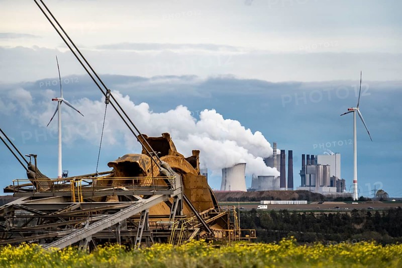 Lignite opencast mine Garzweiler II, bucket wheel excavator dredging, at the edge of the opencast mine near the village of Lützerath, f, wind farm, Neurath lignite-fired power plant, North Rhine-Westphalia, Germany, Europe
