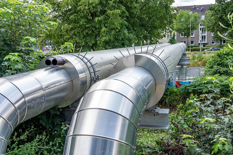 New STEAG district heating pipeline in Essen, over the railway tracks of the S6 line in Essen-Süd, part of the new 12 km long eastern route through the city, North Rhine-Westphalia, Germany, Europe