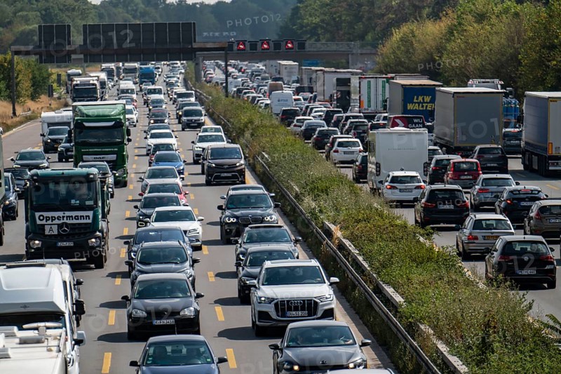 Traffic jam on the A3 motorway, over 8 lanes, in both directions, between the Leverkusen motorway junction and the Cologne-Mülheim junction, looking south, Friday afternoon heavy traffic, delays due to the traffic jam, Leverkusen, North Rhine-Westphalia, Germany, Europe