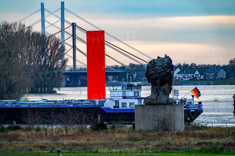 Flood on the Rhine near Duisburg, freighter in the harbour canal, Neuenkamp Rhine Bridge, old and new construction, landmark Rhine Orange, washed by the flood, sculpture The Echo of Poseidon, on Mercator Island, washed by the flood, North Rhine-Westphalia, Germany, Europe