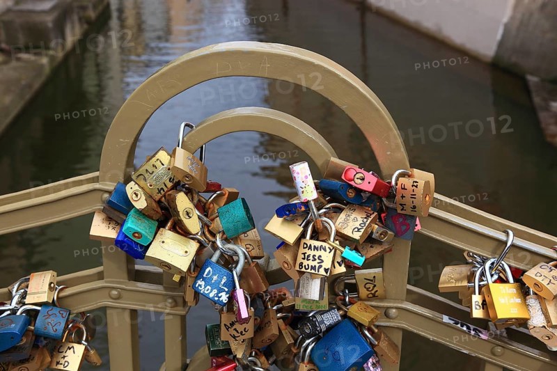 Lover's lock on a railing, love lock is a padlock which, according to custom, is attached to bridges by lovers to symbolically seal their eternal love, Prague, Czech Republic, Europe