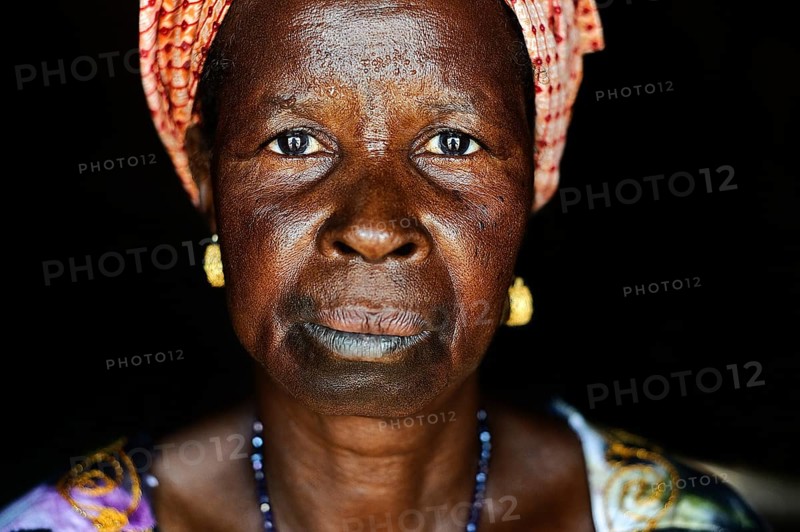 Portrait of a woman with traditional lip tattoo Gambia . She belongs to the Fula ethnic group