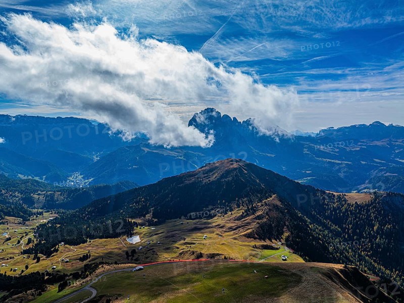 The Picberg, behind it the peaks of the Sassolungo Group, shrouded in mist, drone shot, Val Gardena, Dolomites, Autonomous Province of Bolzano, South Tyrol, Italy, Europe