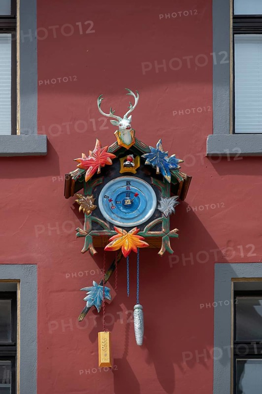 Colourful cuckoo clock on a house, Villingen-Schwenningen, Baden-Württemberg, Germany, Europe