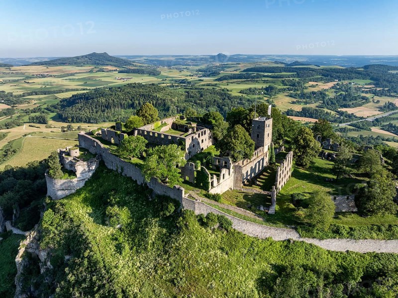 Aerial view of the volcanic cone Hohentwiel with Germany's largest fortress ruins, on the horizon the Hohenstoffeln and Hohenhewen, district of Constance, Baden-Württemberg, Germany, Europe