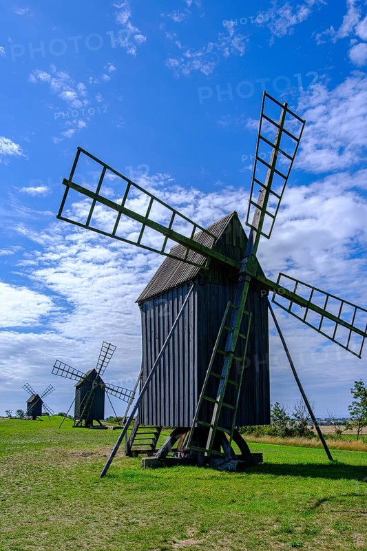 Three traditional historic windmills (Resmo väderkvarnar) in the village of Resmo on Öland, Kalmar län, Sweden, Scandinavia, Europe