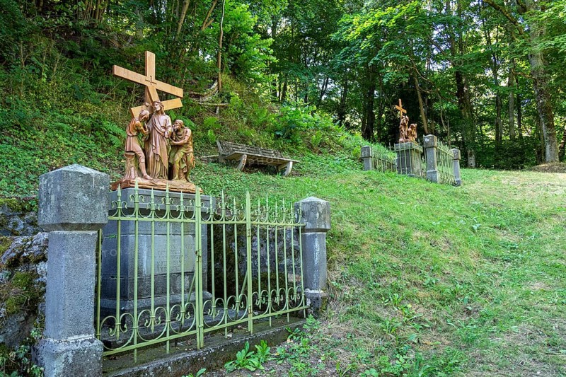 Orcival in Auvergne Volcanoes Regional Natural Park, Statues of Christ's Way of the Cross. Puy de Dome. Auvergne-Rhone-Alpes. France