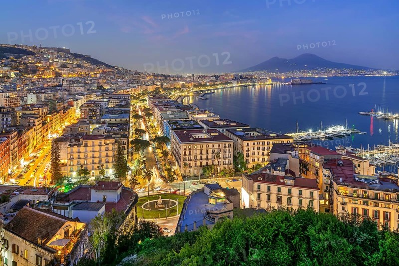 Western district of Mergellina by the sea with the Vomero and Mount Vesuvius 1281m at dusk, Naples, Gulf of Naples, Campania, Italy, Europe