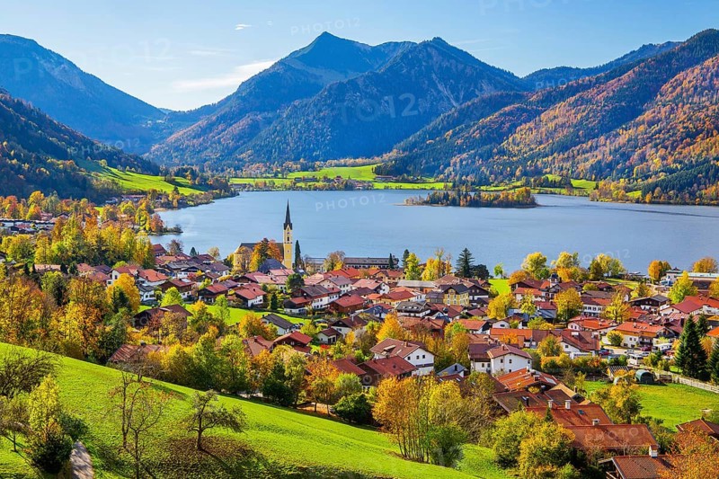 Panorama of the village and lake with the parish church of St. Sixtus and the Brecherspitz 1683m in the Mangfall mountains in autumn, Schliersee, Upper Bavaria, Bavaria, Germany, Europe