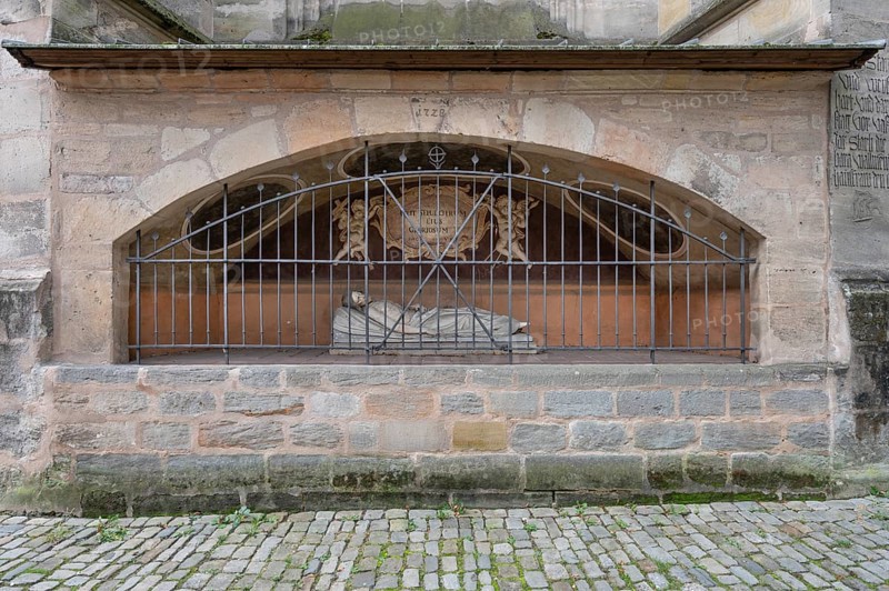 Jesus on the deathbed, sculpture in an outside chapel on the east choir of the late Gothic St George's Church, Dinkelsbühl, Bavaria, Germany, Europe