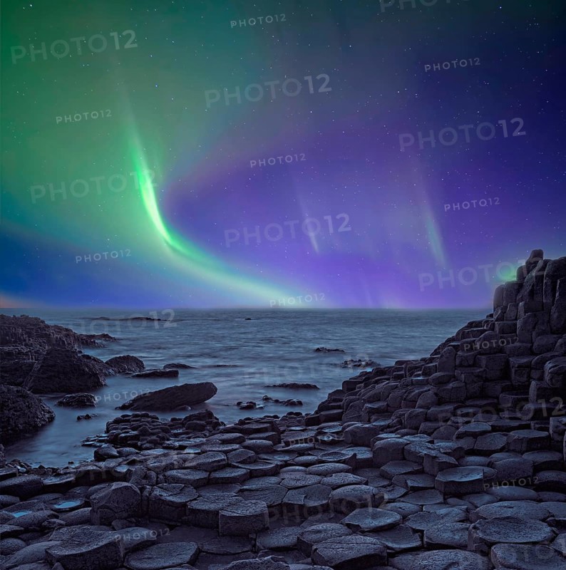 Giant's Causeway basalt columns with aurora borealis Northern Ireland