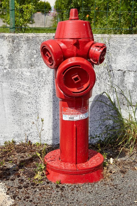 Red fire hydrant in Saint-Palais-sur-Mer, Département Charente-Maritime, Nouvelle-Aquitaine, France, Europe