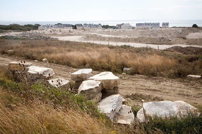 Working quarry and new housing built with local stone, Isle of Portland, Dorset, England, United Kingdom, Europe