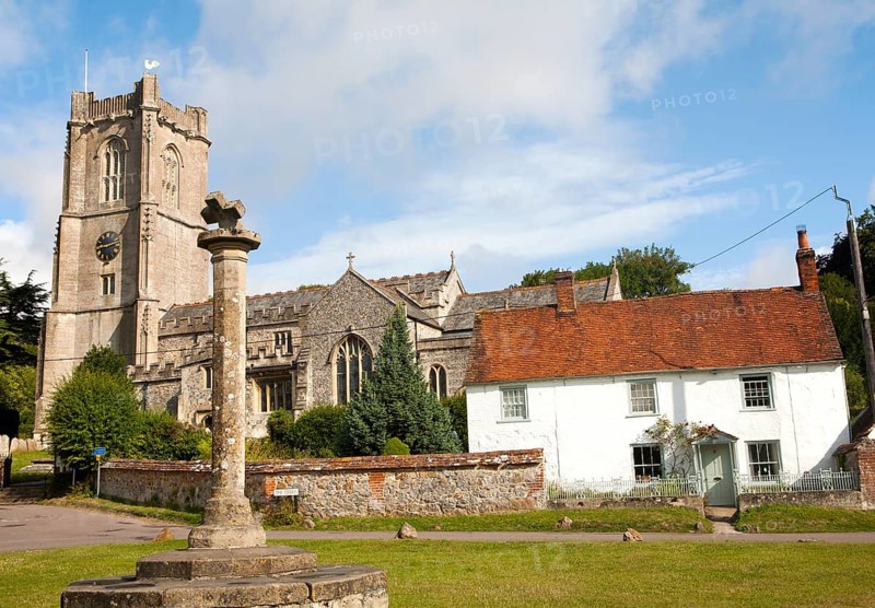 Church of St Michael and butter cross on the village green in Aldbourne, Wiltshire, England, United Kingdom, Europe
