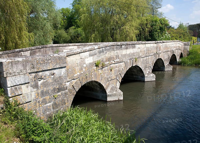 Stone bridge crossing River Avon chalk river at Amesbury, Wiltshire, England, United Kingdom, Europe