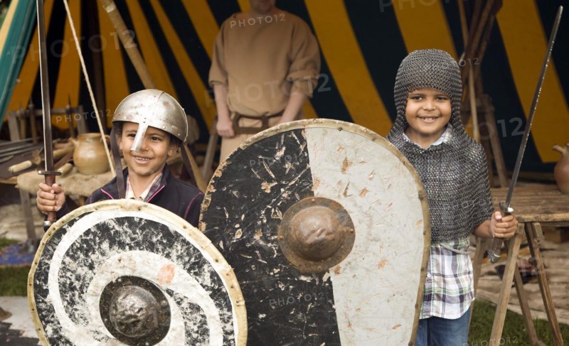 Two boys dressed as soldiers Historical re-enactment Saxon, Viking, Norman history, Woodbridge, Suffolk, England, UK
