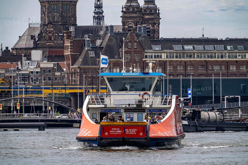 GVB ferries for pedestrians and cyclists across the river Ij, at Amsterdam Centraal station, free of charge, to the eastern parts of the city, Netherlands