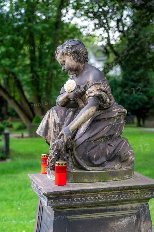 Figure in a cemetery, old gravestone, with flower and grave light, North Rhine-Westphalia, Germany, Europe