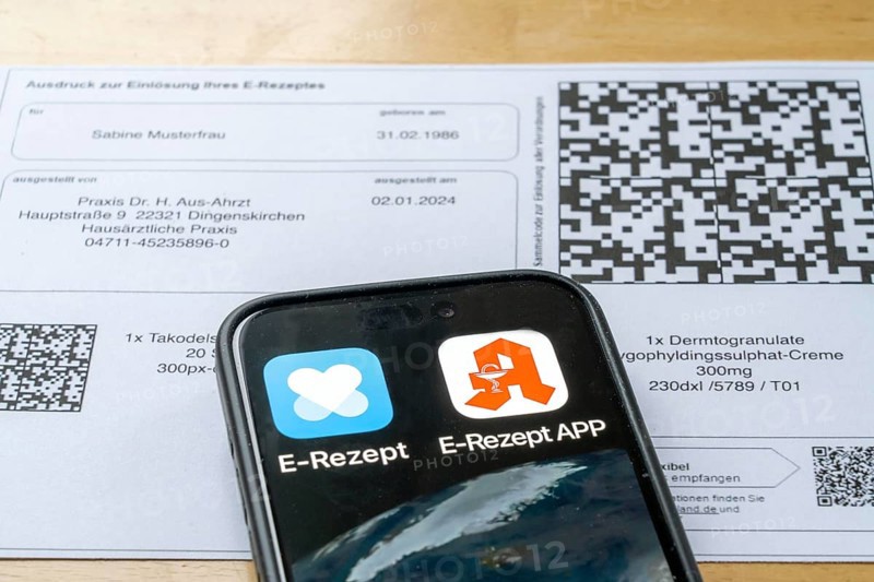 Symbolic image of an e-prescription, prescription issued by a doctor, with QR code, is scanned using a mobile phone and a special app, the code is then shown in the pharmacy and the prescription, which is stored on an IT server, can be retrieved there in conjunction with the health card