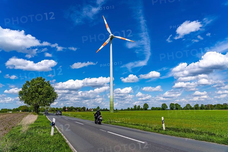 Wind turbine, wind energy plant from the manufacturer Enercon, blue sky with many white clouds, near Schermbeck, country road, Bestener Straße, North Rhine-Westphalia, Germany, Europe