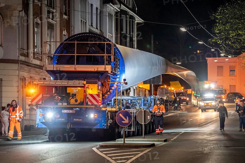 Transport of a 68 metre long, 22 tonne blade of a wind turbine, here in Schwelm, with a self-propelled Blade-Lifter vehicle, over a 40 km long route, over 2 nights, in the Bergisches Land, through towns, villages, over country roads, narrow through roads, to the construction site of the wind turbine near Hagen, North Rhine-Westphalia, Germany, Europe