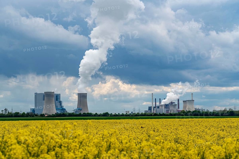 Neurath lignite-fired power station, near Grevenbroich, RWE Power AG, storm clouds over the Rhenish lignite mining area, rape field, North Rhine-Westphalia, Germany, Europe