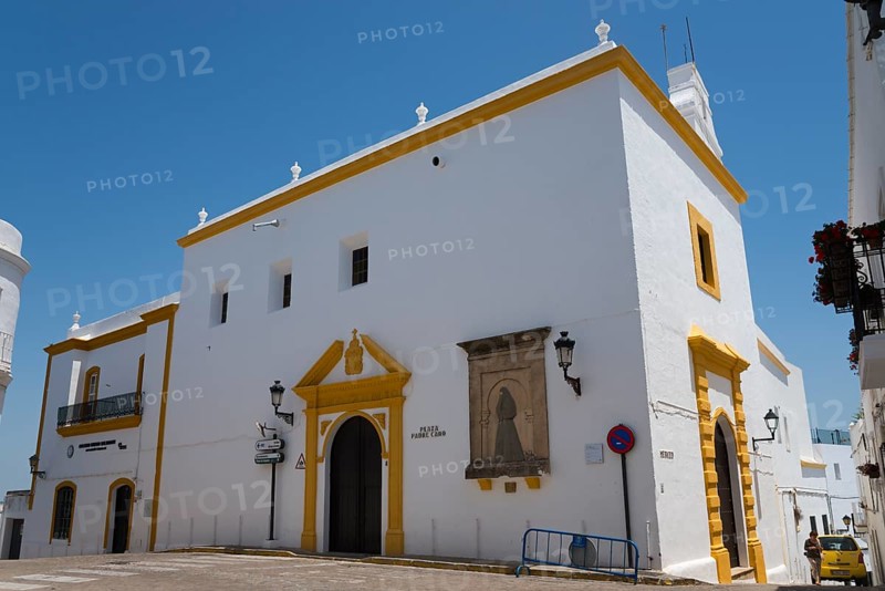 White church with yellow details, under a blue sky, in Mediterranean architectural style, Iglesia del Convento de la Merced, Plaza Padre Caro, square, old town, Vejer de la Frontera, province of Cádiz, Cadiz, Andalusia, Spain, Europe