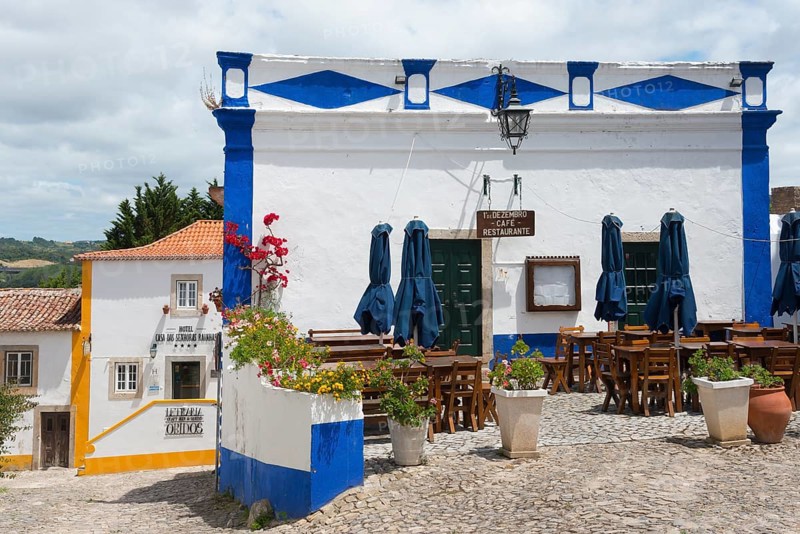 Outdoor area of a restaurant with blue accents under a sunny sky, Óbidos, Obidos, Oeste, Centro, Estremadura, Portugal, Europe