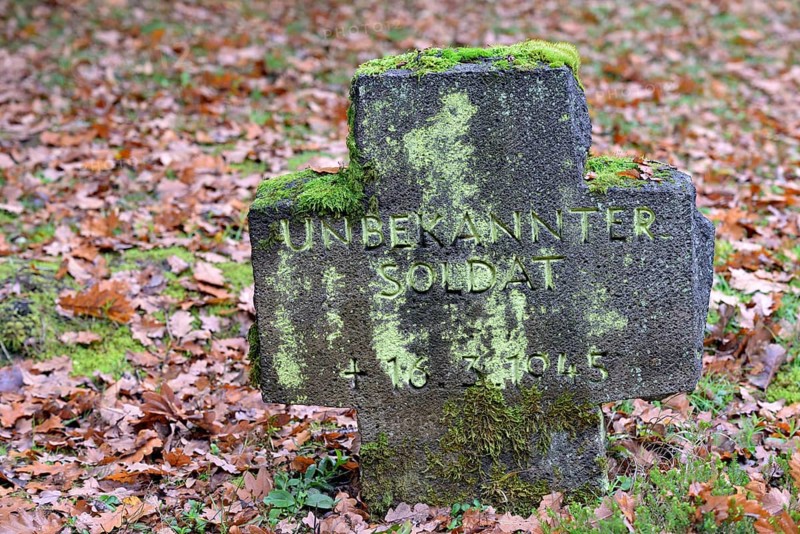 Military cemetery from the Second World War, moss-covered stone cross with inscription, Moselle, Rhineland-Palatinate, Germany, Europe