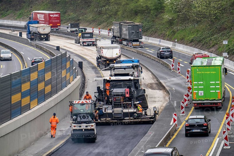 Motorway construction site on the A52 in Essen Basic refurbishment of the motorway, new noise barriers, sewerage system, new road surface, asphalting work, North Rhine-Westphalia, Germany, Europe