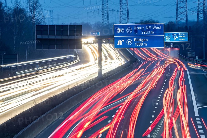 A57 motorway near Kaarst in the Rhine district of Neuss, view in the direction of the Büttgen junction, heavy evening traffic, overhead power lines, along the motorway, North Rhine-Westphalia, Germany, Europe