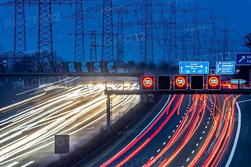 A57 motorway near Kaarst in the Rhine district of Neuss, view in the direction of the Kaarst motorway junction, heavy evening traffic, overhead power lines, along the motorway, North Rhine-Westphalia, Germany, Europe