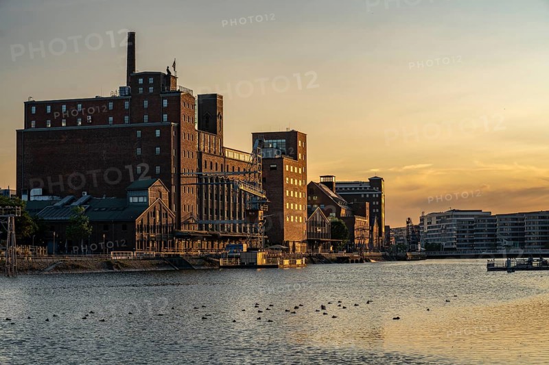 The inner harbour, in Duisburg, Werhahn-Mühle building on the left, granary with Explorado Children's Museum, Faktorei 21 building on the right, North Rhine-Westphalia, Germany, Europe
