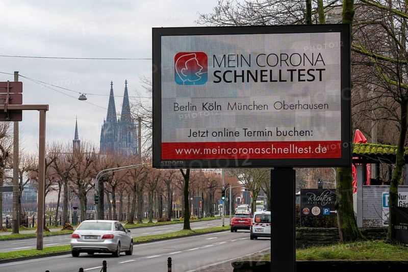 LED billboard, with digital advertising for Corona rapid tests, in the test centre in Cologne, on Konrad-Adenauer-Ufer in Cologne, North Rhine-Westphalia, Germany, Europe