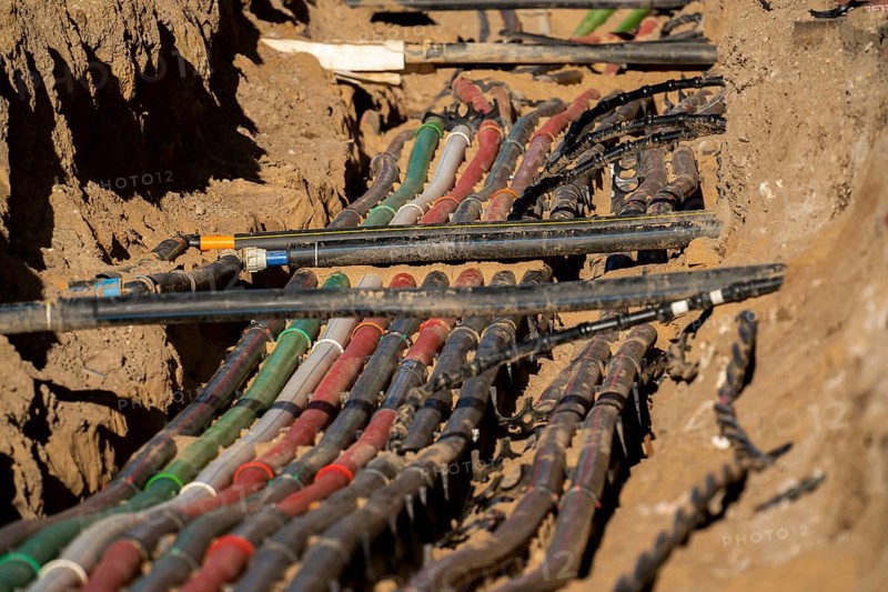 Cables, pipes, next to each other in a construction site, supply lines exposed during construction work, Schadowstraße in Düsseldorf