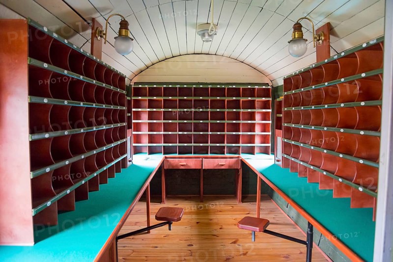 Interior view of a mail coach with wooden shelves and desks, mail coach, railway museum, Elk, Elk, Lyck, Warmia-Masuria, Poland, Europe