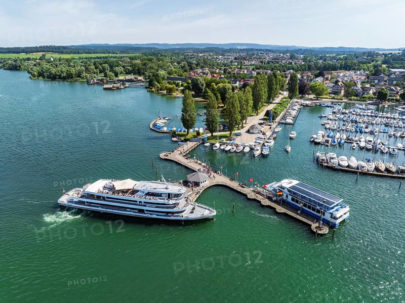 The yacht harbour, marina, harbour of Unteruhdlingen, Uhldingen-Mühlhofen with the passenger ship MS Überlingen of the Lake Constance-Schiffsbetriebe, behind it the pile dwellings, pile dwelling museum, Lake Constance district, Lake Constance, Baden-Württemberg, Germany, Europe