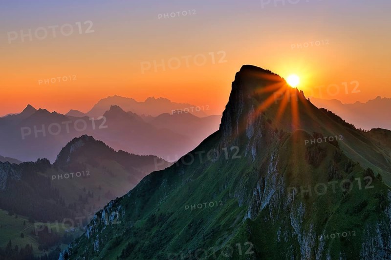 Tierberg at sunrise, behind it the Appenzell Alps with Alpstein and Säntis, cantons of Glarus and St. Gallen, Switzerland, Europe