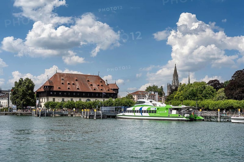 View over the harbour basin of Constance with the catamaran, the council building on the lakeside promenade and the cathedral tower in the historic old town, Lake Constance, Constance district Baden-Württemberg, Germany, Europe
