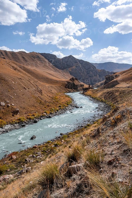 Mountain valley with river between golden meadows, Bolgart Valley, Naryn Province, Kyrgyzstan, Asia