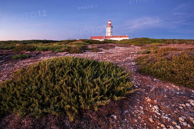 Lighthouse on Cabo Espichel cape Espichel on Atlantic ocean at dusk evening twilight. Sesimbra, Portugal, Europe