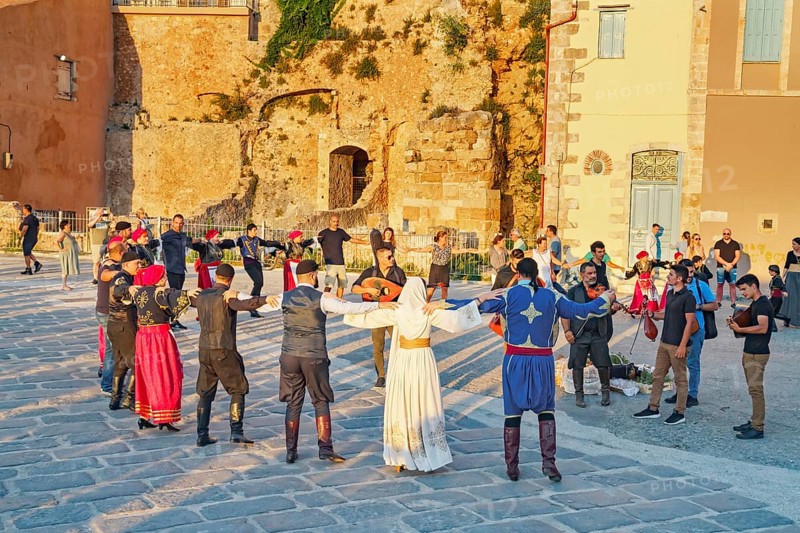 Group of people performing traditional Greek dance, Chania, Crete, Greek Islands, Greece, Europe