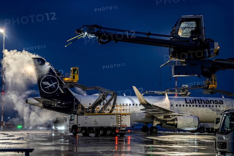 Winter at Frankfurt Main Airport, FRA, Lufthansa aircraft being de-iced by de-icing vehicles, Hesse, Germany, Europe