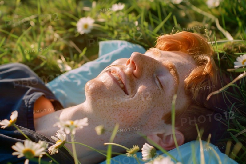 Teenager, young fair-skinned man with red hair and freckles lying on a spring meadow and basking in the first spring sun, health risk, possible late effects, risk of skin cancer due to intense UV radiation that can cause sunburn, AI generated, AI generated, AI generated
