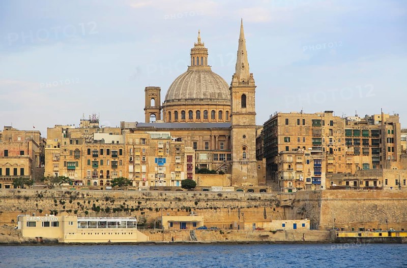 Soft evening light on buildings and churches Valletta, Malta, dome Basilica of Our Lady of Mount Carmel church, Europe