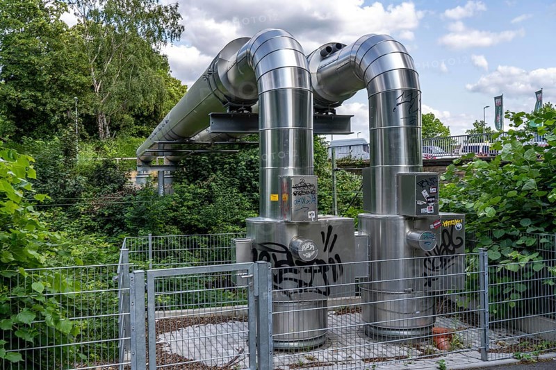 New STEAG district heating pipeline in Essen, over the railway tracks of the S6 line in Essen-Süd, part of the new 12 km long eastern route through the city, North Rhine-Westphalia, Germany, Europe