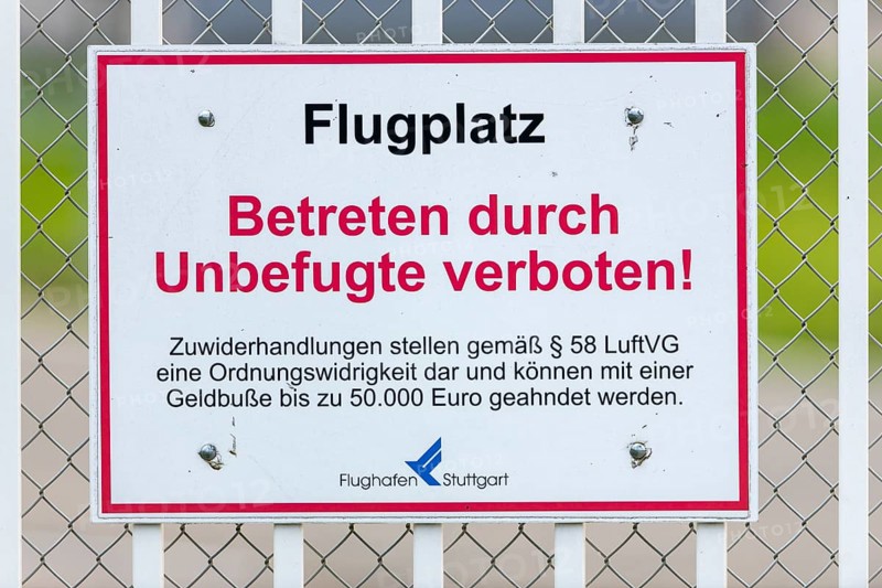 Sign on an airport barrier fence, trespassing by unauthorised persons prohibited, Stuttgart, Baden-Württemberg, Germany, Europe