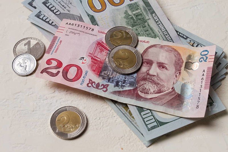 Lari, 20 GEL, Georgian monetary currency, with dollars, banknotes, top view, no people, on the table