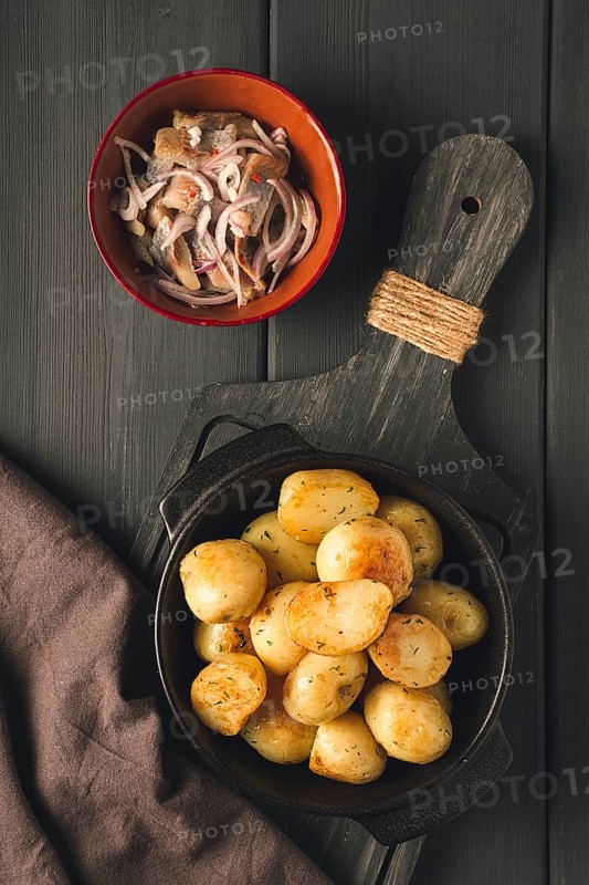 Fresh Cooked, new potatoes, with dill, on a wooden table, selective focus. close-up, toning, no people